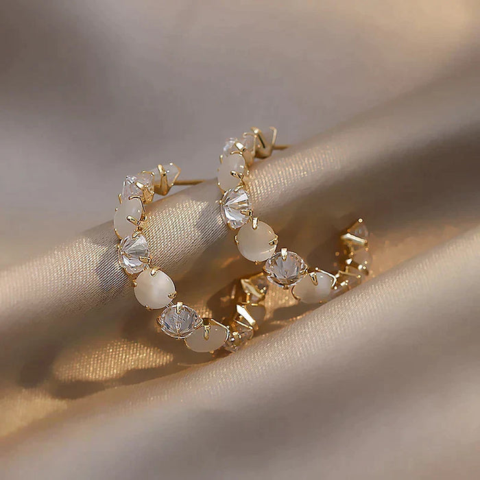 Elegant Gold Earrings Featuring White Opal and Crystal Accents