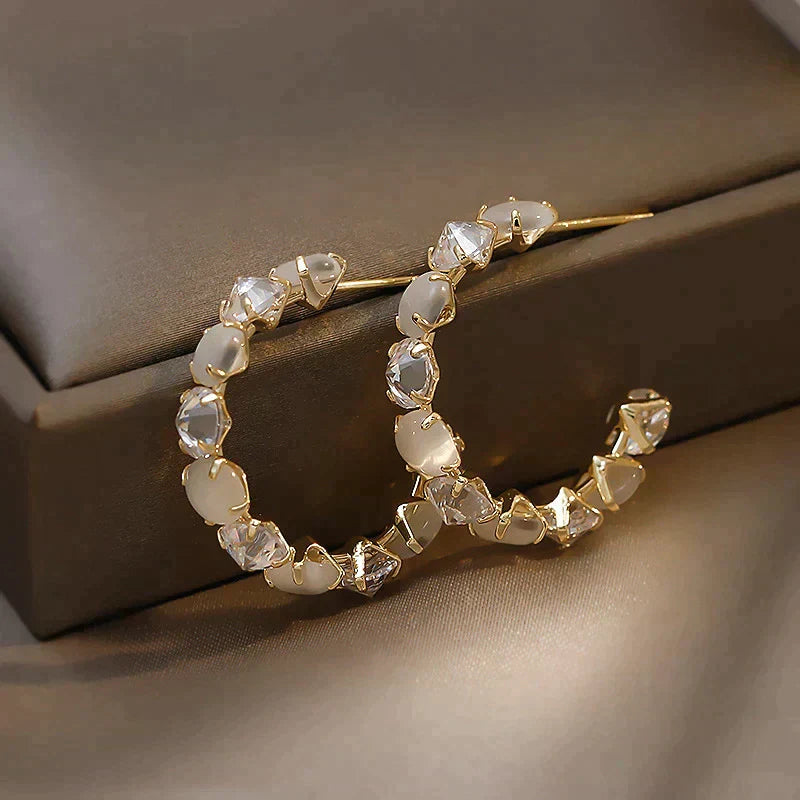 Elegant Gold Earrings Featuring White Opal and Crystal Accents