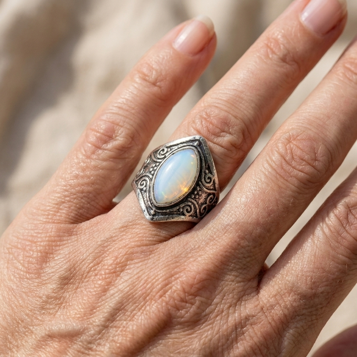 Antique-Inspired Teardrop Moonstone Ring Featuring an Intricate Silver Band