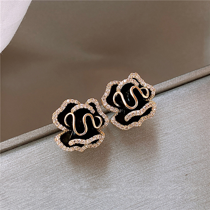 Sophisticated Gold Lotus Earrings in Elegant Black