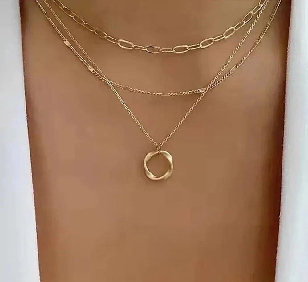 Vintage-inspired gold layered chain necklace with charm